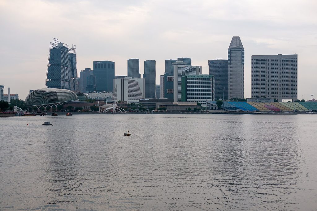 Singapore Is Writing Heat Into Its Rulebook for Work, Sport and School The Singapore skyline across Marina Bay on a bright day